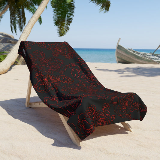 Bold Rose Blossom Beach Towel. Black Beach towel With Large Bold Red Roses scattered through out. 