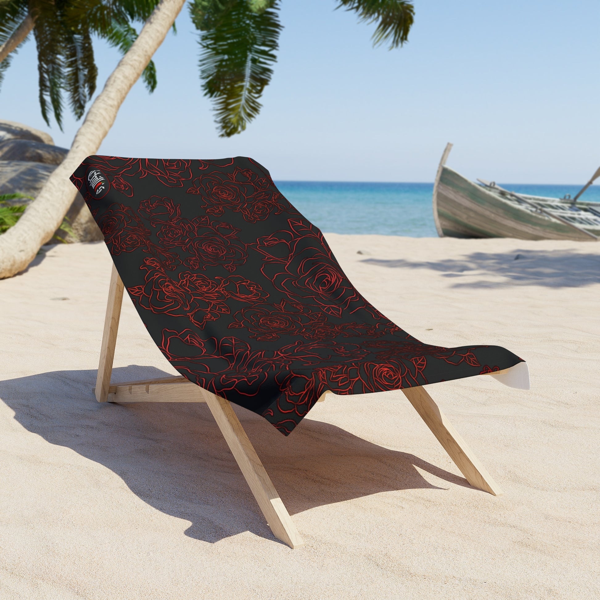 Displayed is the Bold Rose Blossom Beach towel thrown over a  a beach chair.