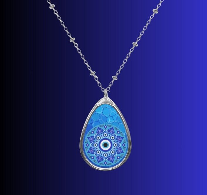 The vibrant blue color of the evil eyes symbolizes protection and positivity, making this necklace as meaningful as it is beautiful.